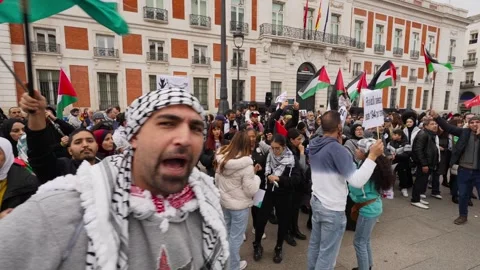 Crowd gathered shouting during Pro-Palestine protest in Puerta Del Sol_3 Stock Footage 254366620