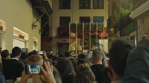 Crowd gathered for watching Holy Week procession in Seville, Spain during 스톡 동영상 307614924
