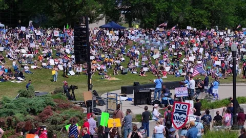 Crowd gathers during No Kings protest at Ah-Nab-Awen Park protesting against 動画素材 312259141