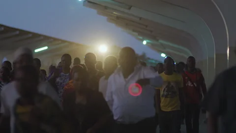 Crowd getting off the train in the evening .DaresSalaam Tanzania Stock Footage 132225408