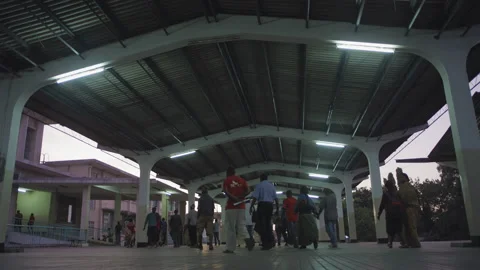 Crowd getting off at the train station in the evening.DaresSalaam Tanzania Stock Footage 132221838