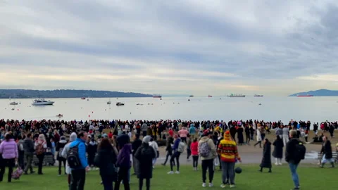 Crowd On Grass And Beach Overlooking Boats At English Bay Vancouver Bc Canada Stock Footage 260272484