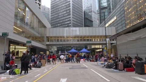 A crowd of happy people do a flashmob together on a busy street, zoom in Stock Footage 146590502