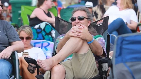 Crowd haveing fun at an open-air music festival in summer Stock-Footage 73497682