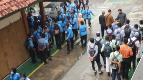 A crowd of high school students in the school yard. Footage taken in Java Stock Footage 203821540