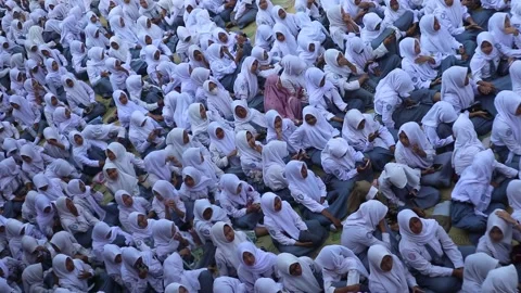 Crowd of high school students studying outside the classroom. Video stock 343827232