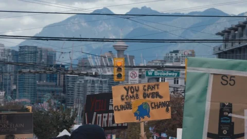 Crowd holding climate action protest signs. Vancouver, Sept 2019. Stock Footage 117962208