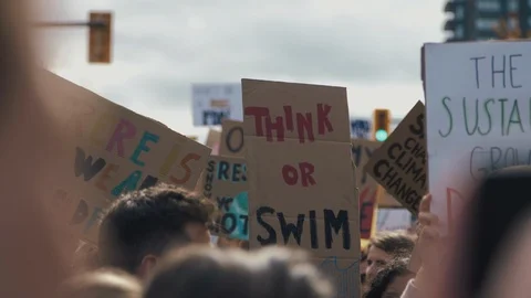Crowd holding signs protesting for climate action. Vancouver, Sept 2019. Video stock 117963251