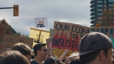 Crowd holding signs protesting for climate action. Vancouver, Sept 2019. Stock Footage 117963565