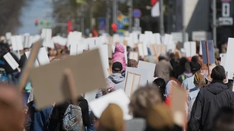 Crowd human walking down street Russia with banners defending their rights. Stock Footage 121279907