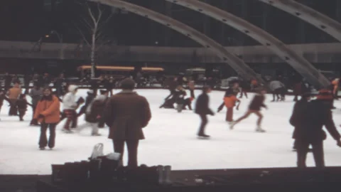 Crowd Ice Skates under Arches at Nathan Phillips Square in Toronto 1970s Stock Footage 306824373