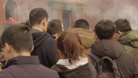 Crowd with Incense Sticks at Lama Temple in Beijing, China During Religious Stock Footage 345684748