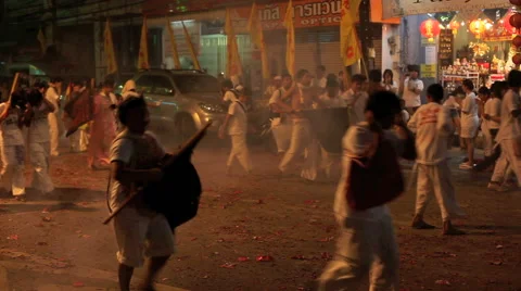 Crowd including spirit mediums marching through exploding fireworks Stock Footage 41623158