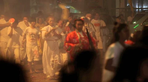 Crowd including spirit mediums marching through exploding fireworks Stock Footage 41645115