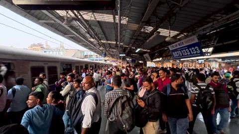 Crowd of Indian commuters waiting for a local train Stock Footage 336705036