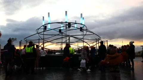 Crowd interact with illuminated spiral light looper neuron artwork, Stock Footage 220413151