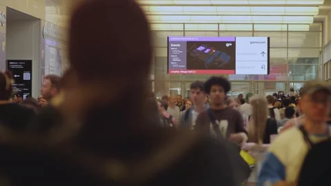 Crowd Interaction at a Busy Event Venue Video stock 345010086