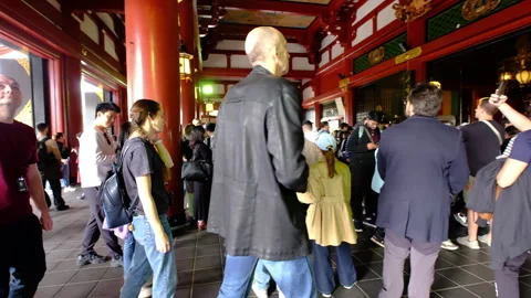 Crowd of international tourists walking inside a Japanese Buddhist Temple Stock Footage 337183001