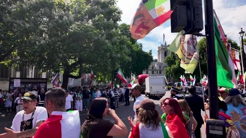 Crowd of Iranian people with flags and banners protesting for freedom and Stock Footage 337646654