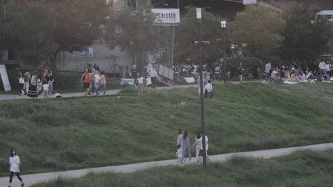 Crowd of Koreans at Han River enjoying the weekend Stock Footage 115521178