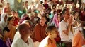Crowd of Krishna worshippers sings mantras in the Krishna temple HD Footage