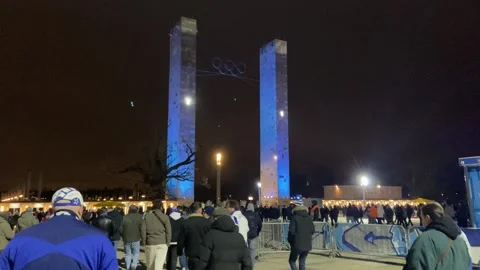 Crowd leaving stadium at night after soccer match, urban event scene Stock Footage 330864060