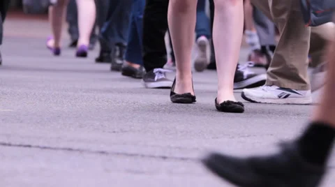 Crowd legs at a busy intersection crossing Stock Footage 33795981