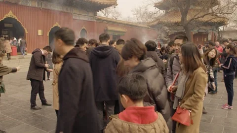 Crowd Lighting Incense and Praying at Temple Courtyard in Beijing, China Stock Footage 345684717