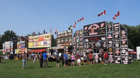 Crowd Lined Up for Ribs at BBQ Ribfest Event Blue Sky Sunny Day 動画素材 94217190