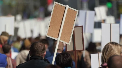 Crowd man walking down street France with banners defending their rights 4K Stock Footage 112047583