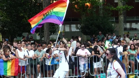 Crowd marching and dances while waving a rainbow flags Stock Footage 339205390