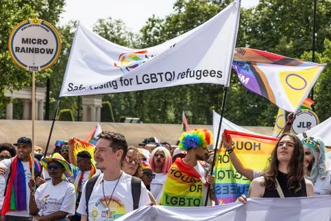 Crowd marching with banners at London Pride parade. London, UK, 29 June 2024 Stock Photos
