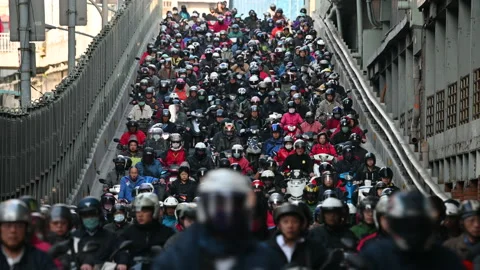 Crowd of motorcycles stacked on elevated road in Taipei Stock Footage 131886092