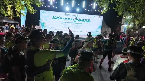 Crowd of Neon Vested Runners Facing Stage, One Arm Raised, Lushan Stock Footage 346702067