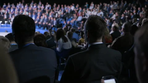 Crowd at official congress for cooperation solution or modern education. Economi Stock Footage 199475446