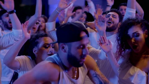Crowd or group of white dressed young, stylish multi-ethnic people during party Vídeos de archivo 132341502