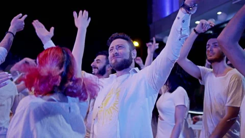 Crowd or group of white dressed young, stylish multi-ethnic people during party Stock Footage 132346606