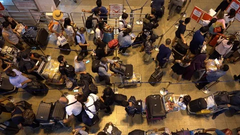 Crowd passengers with luggage in queue at check-in counter at airport, Thailand 스톡 동영상 111799657