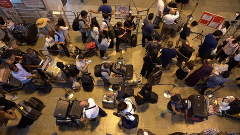 Crowd passengers with luggage in queue at check-in counter at airport, Thailand Stock-Footage 112042486