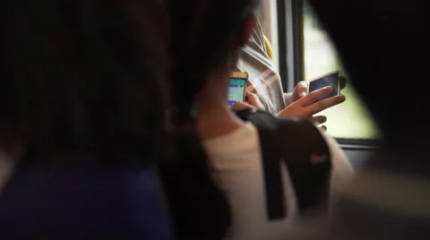 Crowd of passengers using smartphones on public transport. City train Stock-Footage 61691883
