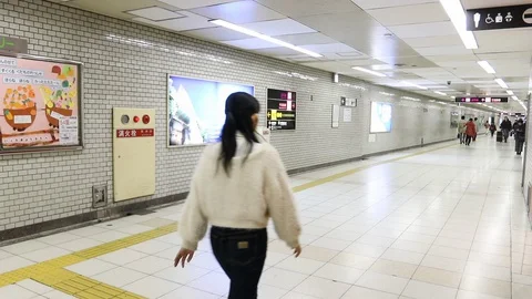 Crowd of passengers walk in a subway train station, Kyoto, Japan. Stock Footage 128817711