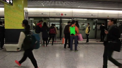 Crowd of passengers walk in Tsim Sha Tsui station  Stock Footage 61539337