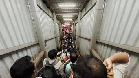 Crowd of passengers walking escalators in subway station at busy hours. 4K Stock-Footage 250721564