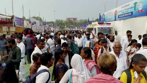 Crowd of passersby or devotees covered in colors walking in the street. Stock Footage 257883141