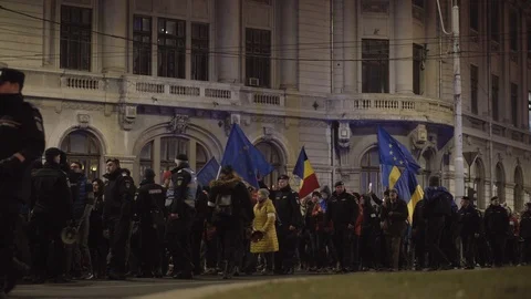 Crowd passes by the University Square in Bucharest during anti-corruption march Stock Footage 104076863