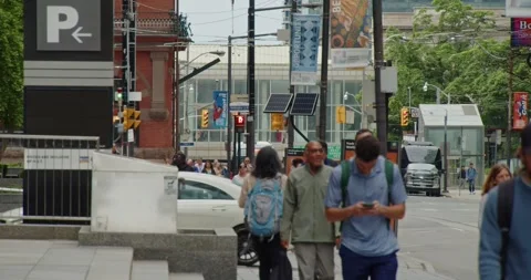 A crowd of pedestrians crossing an intersection in Toronto during rush hour. Stock Footage 278044959