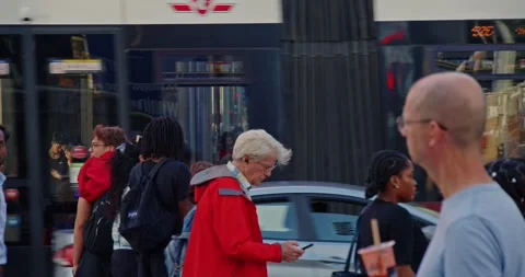 A crowd of pedestrians crossing an intersection in Toronto during rush hour. Stock Footage 278274528