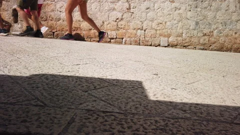 Crowd of pedestrians walking. Low-angle view Stock Footage 251279845