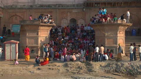 Crowd of people and devotees sitting on historic stone ghat steps Stock Footage 341325115
