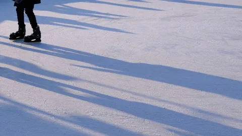 Crowd of People are Skating on Ice Rink in the Sunny Day. Slow Motion Video stock 101018899